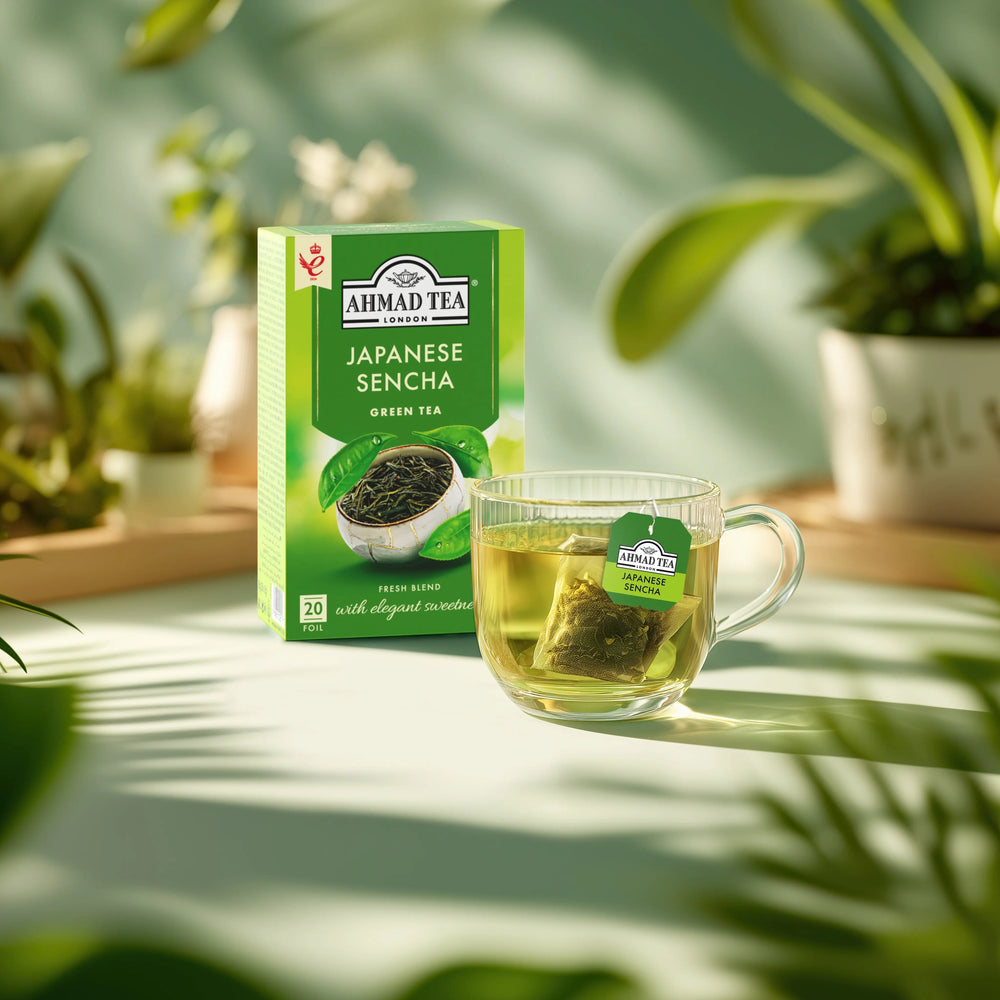 Ahmad Tea Japanese Sencha green tea box and a glass cup of brewed tea from Delikatesi i tako to...