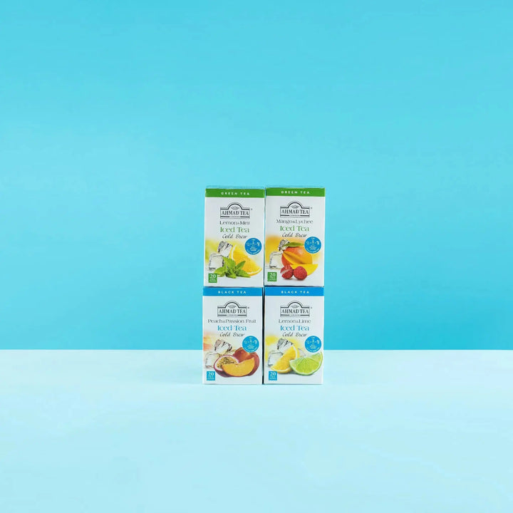 Delikatesi i tako to... Ahmad Tea cold brew iced tea boxes in four fruit flavors on a light blue background
