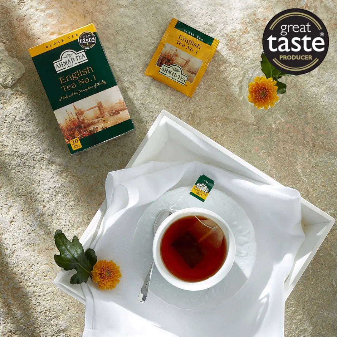 Delikatesi i tako to... Ahmad Tea English Tea No1 black tea box with tea bag and cup on a white tray