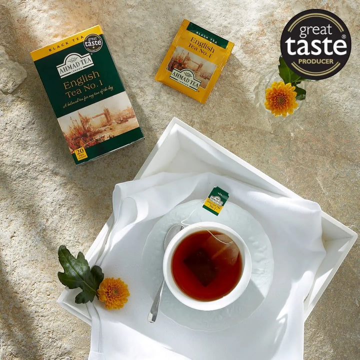Delikatesi i tako to... Ahmad Tea English Tea No1 black tea box with tea bag and cup on a white tray