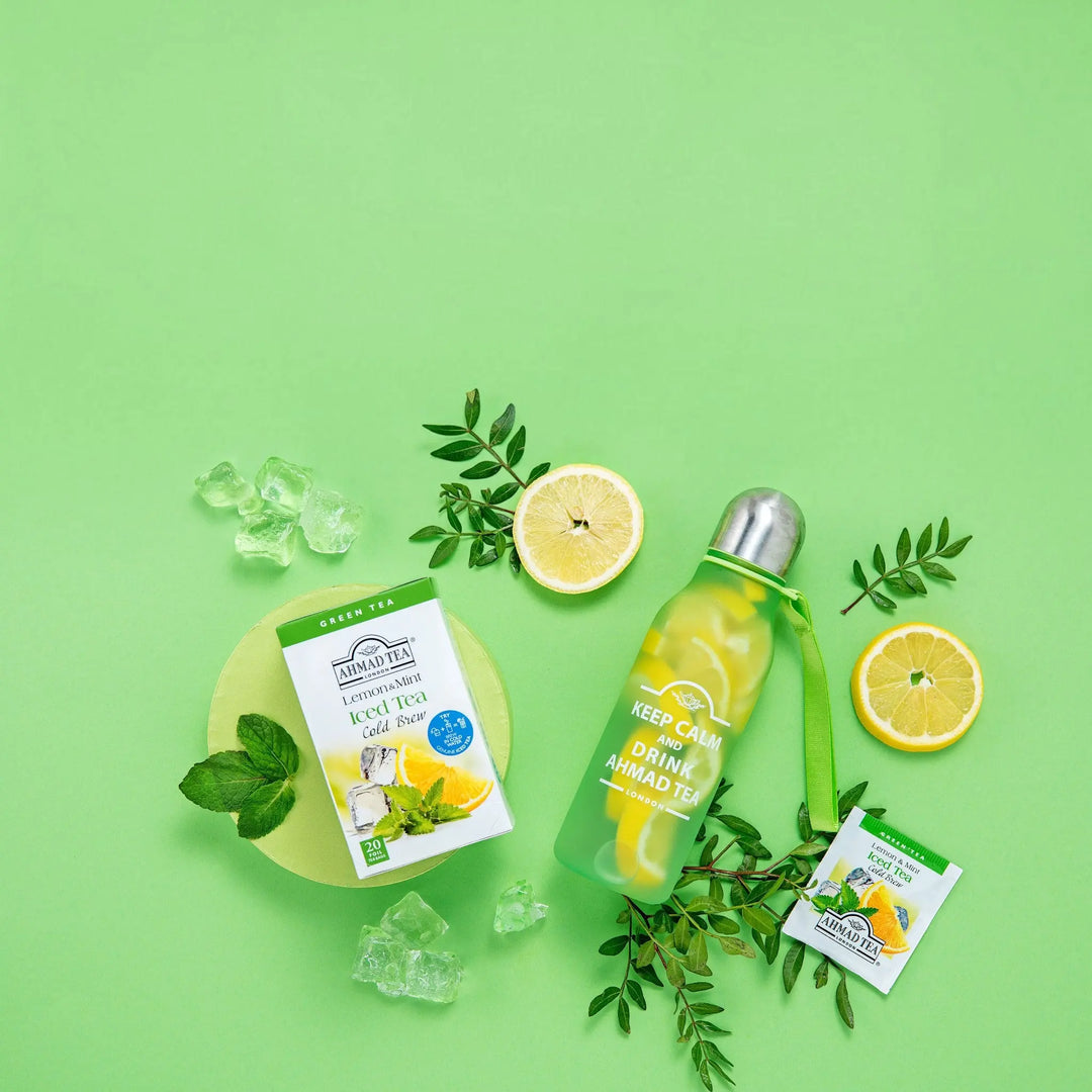 Delikatesi i tako to... Ahmad Tea Lemon & Mint cold brew tea box, tea bag, and water bottle with lemon slices and mint
