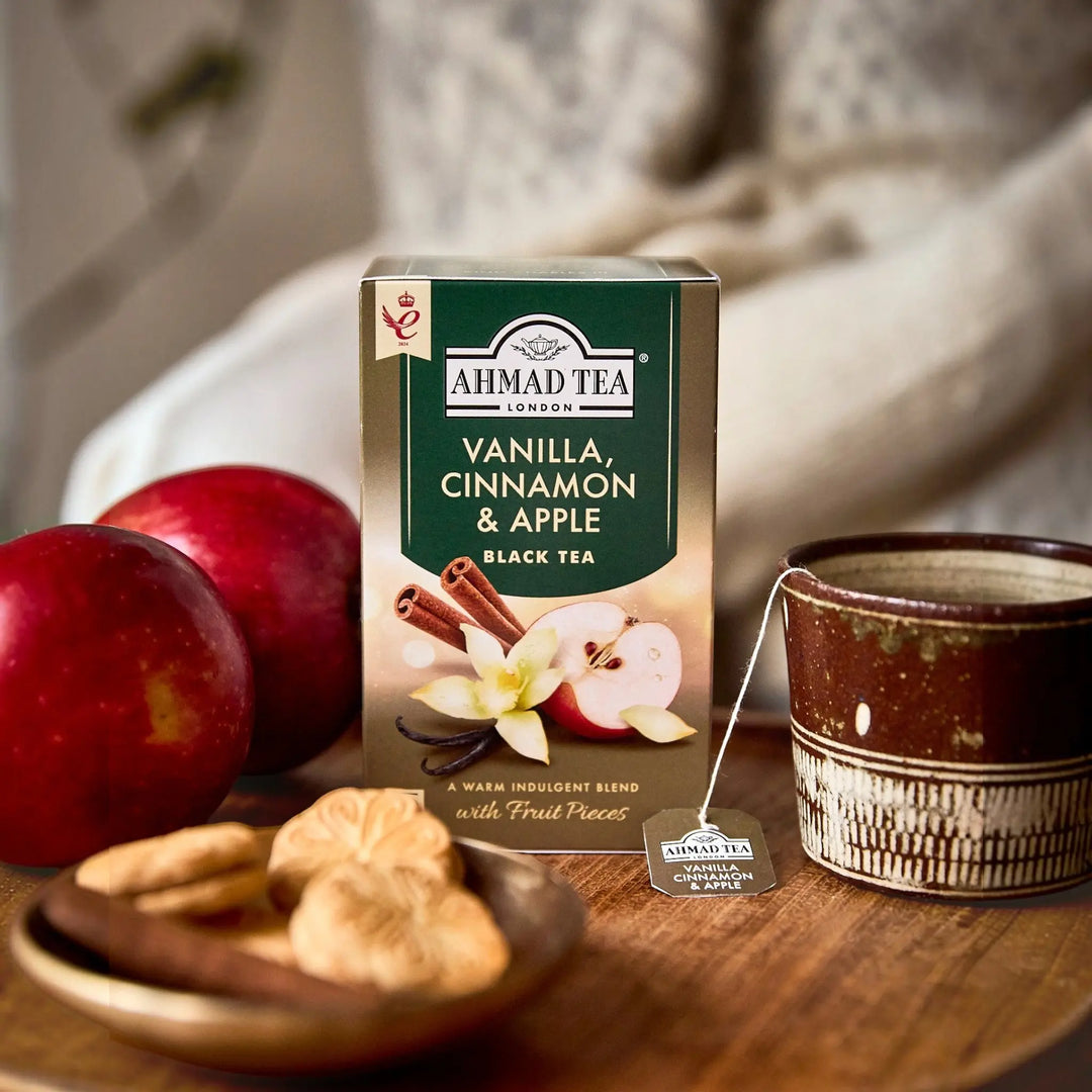 Delikatesi i tako to... Ahmad Tea Vanilla, Cinnamon & Apple black tea box with fresh apples and a tea cup