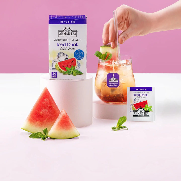 Delikatesi i tako to... Ahmad Tea Watermelon & Mint cold brew tea box, individual sachet, and glass with ice.