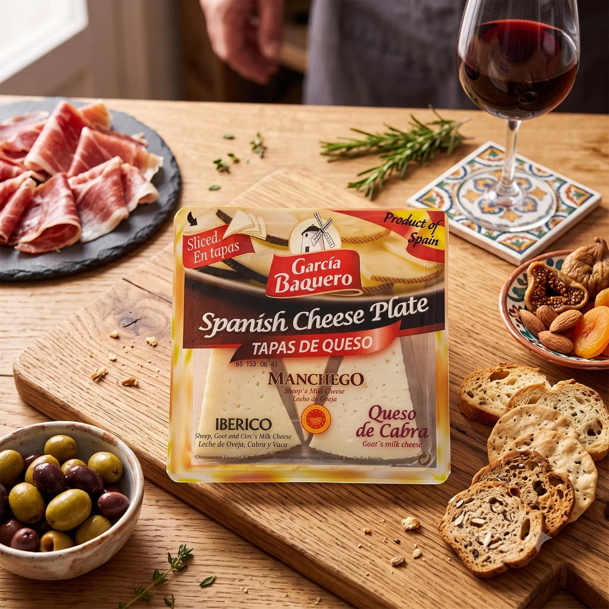 Delikatesi i tako to... Garcia Baquero Spanish cheese plate with Manchego, Iberico, and goat cheese slices on a board