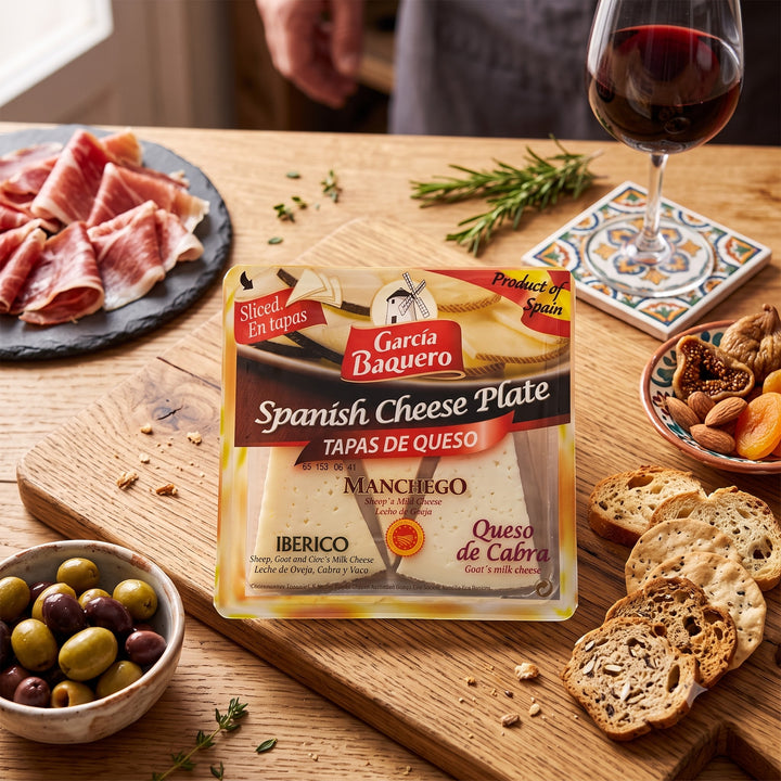 Delikatesi i tako to... Garcia Baquero Spanish cheese plate with Manchego, Iberico, and goat cheese slices on a board