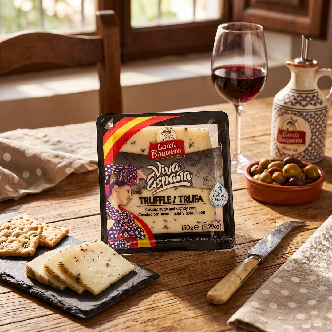 Delikatesi i tako to... Garcia Baquero Viva España truffle cheese wedge with crackers and red wine on a wooden table