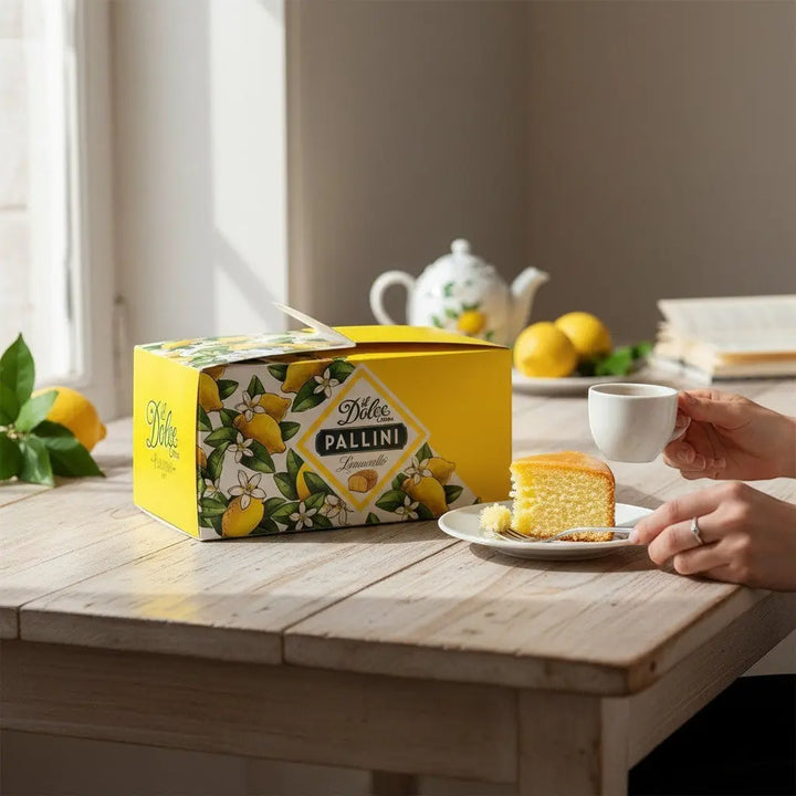 Delikatesi i tako to... Il Dolce Crema Pallini limoncello cake in yellow box served with coffee on a wooden table
