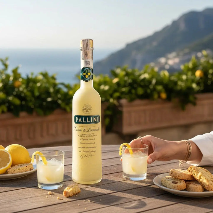 Delikatesi i tako to... Pallini vegan limoncello cream liqueur bottle with glasses and biscotti on a sunny terrace