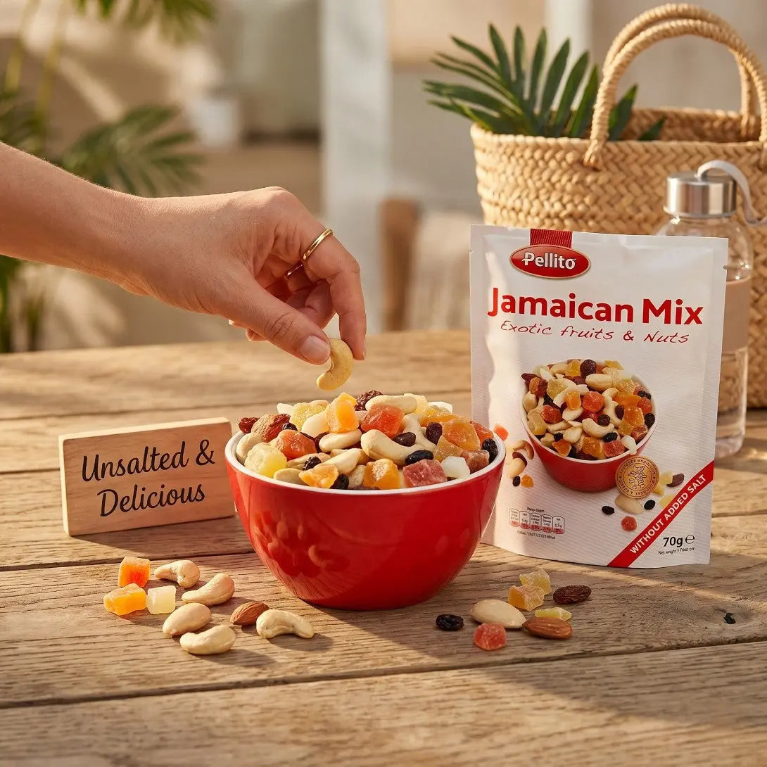 Delikatesi i tako to... Pellito Jamaican exotic fruit and nut mix in a red bowl with a hand reaching for a cashew.