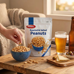 Delikatesi i tako to... Pellito roasted and salted peanuts in a resealable bag with a bowl of nuts and beer on a table.