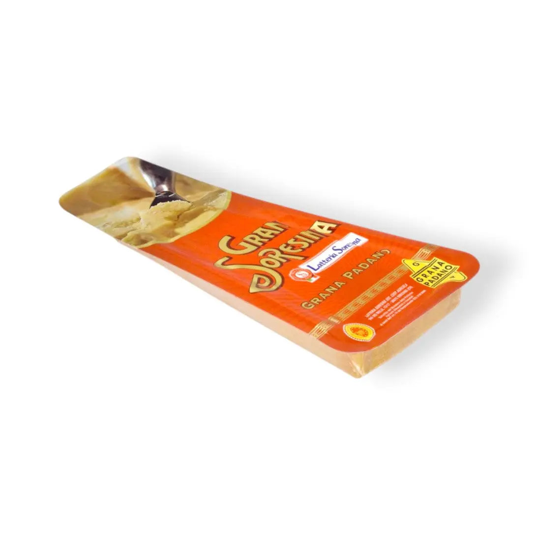 Packaged Grana Padano cheese with branding and product information visible on the label.